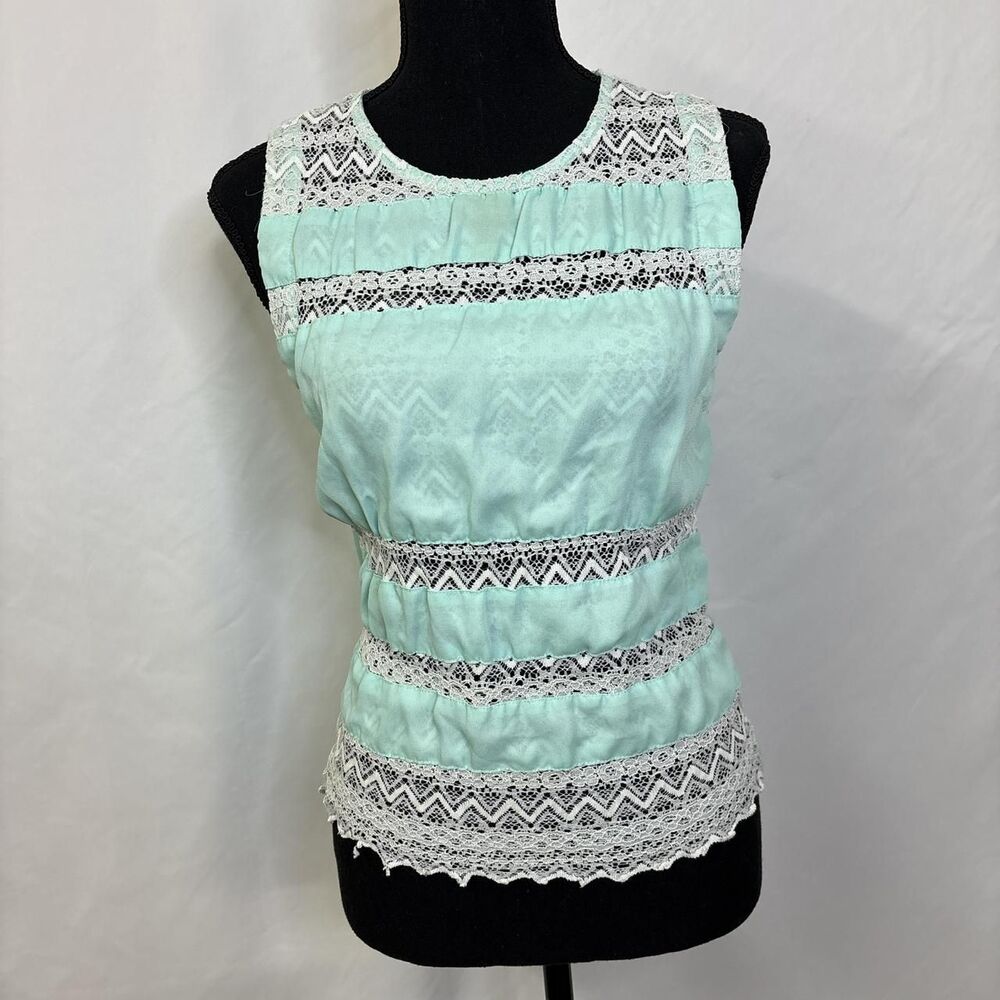 Mint green tank top with white lace details